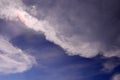 Irisation and clouds in blue sky Royalty Free Stock Photo