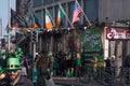 Irish and American flags flying outside an Irish Pub in Dublin, Ireland on St. Patrick`s Day