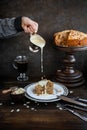 Irish apple pie with almond flakes on a wooden stand.