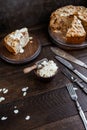 Irish apple pie with almond flakes on a wooden stand.