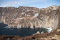 Irish Cliff along Donegal`s coast as it meets the Atlantic ocean.