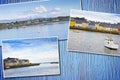 Irish coastal landscape with the typical colored fishermen`s houses - postards concept on colored wooden background Royalty Free Stock Photo