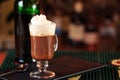 Irish coffee in a bar. Concept of St Patrick holiday. Holiday ba