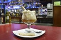 Irish coffee is a cocktail that consists of the mixture of Irish whiskey, a spoonful of sugar, coffee and finally it is covered by Royalty Free Stock Photo