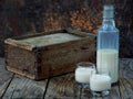 Irish coffee cream liqueur Baileys in glass and botle on wooden background