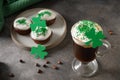 Irish coffee and cupcakes for St Patricks Day. Royalty Free Stock Photo