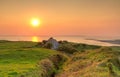 Irish cottage house at sunset