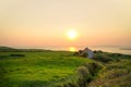 Irish cottage house at sunset Royalty Free Stock Photo