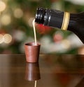 Irish cream liqueur pouring into chocolate Royalty Free Stock Photo