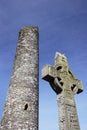 Irish Cross in front of tower Royalty Free Stock Photo