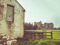 Irish farmhouse and castle with sun