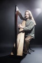 Irish harp player. Musician harpist Royalty Free Stock Photo
