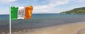 Irish National Flag Tricolour Flying by the Sea in Carnlough Northern Ireland