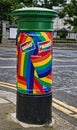 Irish post box or letter box decorated in the pride colours downtown Dublin Ireland