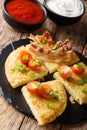 Irish Potato Boxty with bacon, tomato and sauce closeup. vertical Royalty Free Stock Photo