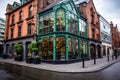 Irish pub in contemporary building window facade. Green decor elements. Street view