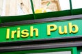 Irish pub sign text on bar entrance in city europe street storefront facade building Royalty Free Stock Photo