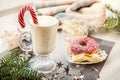 Irish traditional winter cream cocktail eggnog in a glass mug with milk, rum and cinnamon, banana covered with whipped cream, Royalty Free Stock Photo