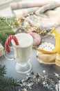 Irish traditional winter cream cocktail eggnog in a glass mug with milk, rum and cinnamon, banana covered with whipped cream, Royalty Free Stock Photo