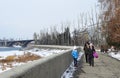 Irkutsk, Russia, March, 16, 2017. People walking on Verhnyaya embankment of Angara river Royalty Free Stock Photo