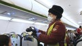 IRKUTSK, RUSSIA - MARCH 24, 2020: Temperature check at a plane aircraft, passengers with thermal imaging camera