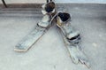 Irkutsk, Russia - May, 22 2016: Sculpture of Old torn shoes and broken country skis in Irkutsk street. Royalty Free Stock Photo