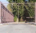 Iron automatic gate to enter the courtyard Royalty Free Stock Photo