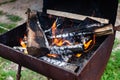 iron barbecue with burning wood and coals. Royalty Free Stock Photo