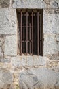 Iron bars in old stone jail