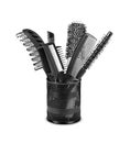 Iron basket with combs and round hair brushes, isolated on white Royalty Free Stock Photo