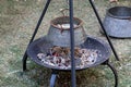 Iron big pot hanging over a fire, cooking soup on a hike Royalty Free Stock Photo