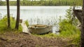 iron boat parked near the shore on the lake Royalty Free Stock Photo