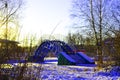 Iron bridge over icy lake in winter Royalty Free Stock Photo