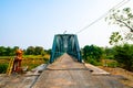 Iron bridge over the river in Sukhothai province Royalty Free Stock Photo