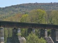 Railway bridge in Hartford Vermont running near route 14 under a deep blue sky