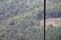 Iron cable from the transportation system of the funicular on the background of a green mountain fores