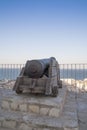 Iron cannon in the castle of cullera Royalty Free Stock Photo