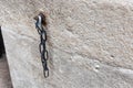 iron chain on ancient church wall Royalty Free Stock Photo