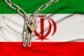 Iron chain and castle on the silk national flag of iran with beautiful folds, the concept of a ban on tourism, political