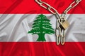 Iron chain, a symbol of bondage,protest against the background of national flag Lebanon, the concept of political repression,