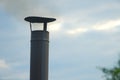 Iron chimney, chimney and smoke against the sky Royalty Free Stock Photo