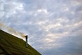 Iron chimney in the house with smoke Royalty Free Stock Photo