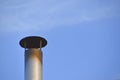 Iron chimney on the roof of the house Royalty Free Stock Photo