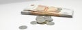 Iron coins next to a stack of five thousandth bills. Russian money, close-up Royalty Free Stock Photo