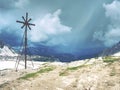 Iron cross at path around mountain Drei Zinnen in South Tyrol