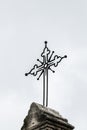 Iron crucifix positioned above a church