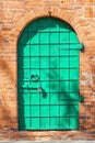 Iron door in a brick wall of one of the most ancient buildings of Russia, Uglich, Yaroslavl region Royalty Free Stock Photo