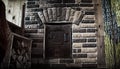 The iron door of the furnace and logs for the furnace.