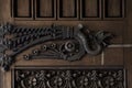 Iron dragon on the main wood door Royalty Free Stock Photo