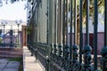 Iron fence along a large building